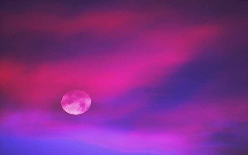 Pink moon in purple sky