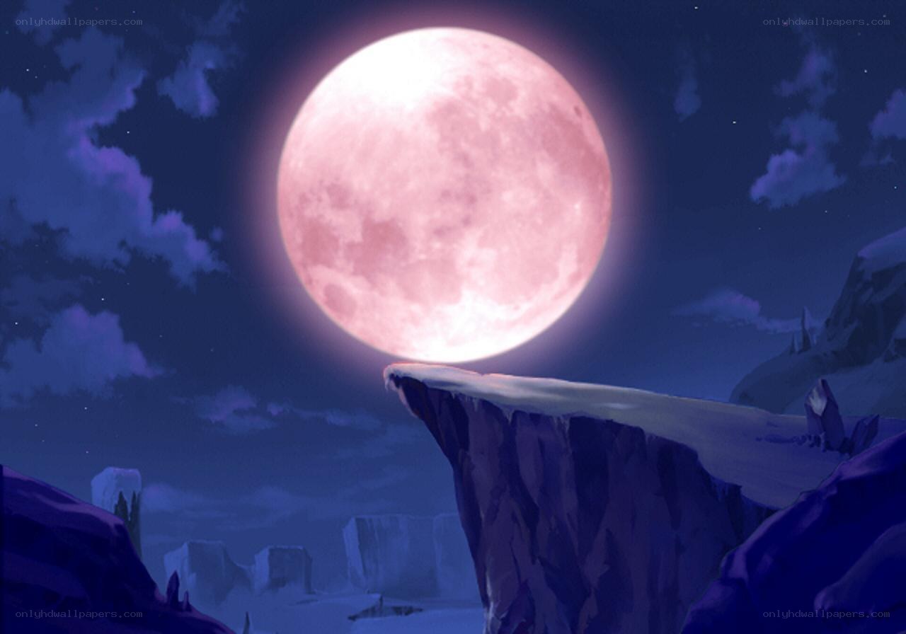 Pink moon over rocky cliffs