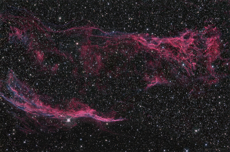 Pink nebula in starfield