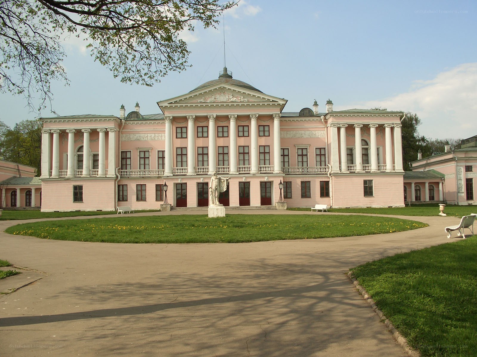 Pink neoclassical palace with statue