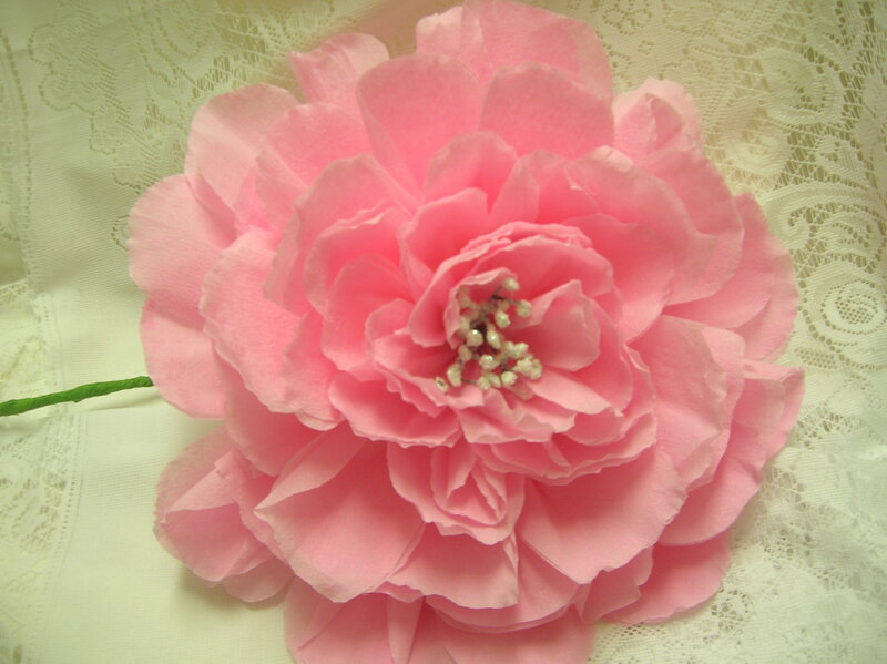 pink paper flower on lace