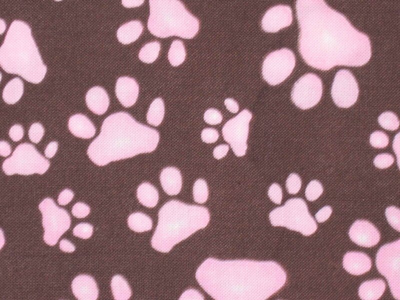 pink paw prints on brown fabric