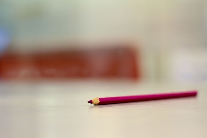 pink pencil on table