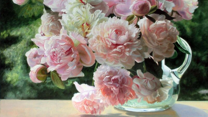 Pink peonies in a glass pitcher
