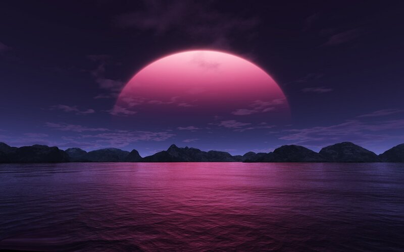 Pink planet over water