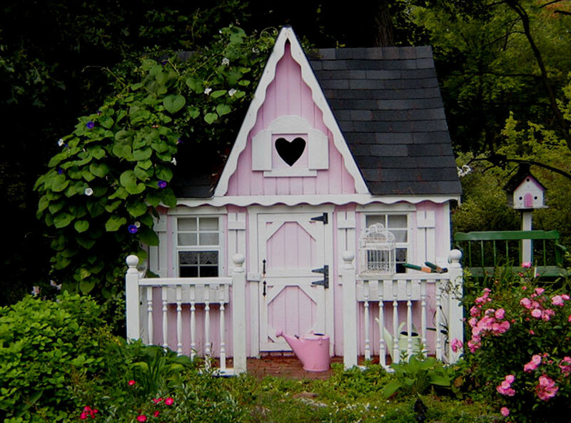 pink playhouse in garden
