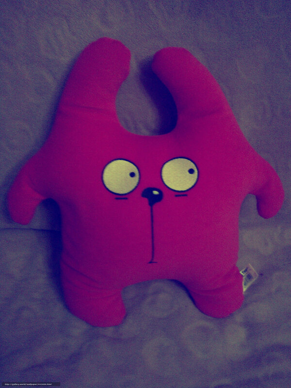 pink plush toy on bed