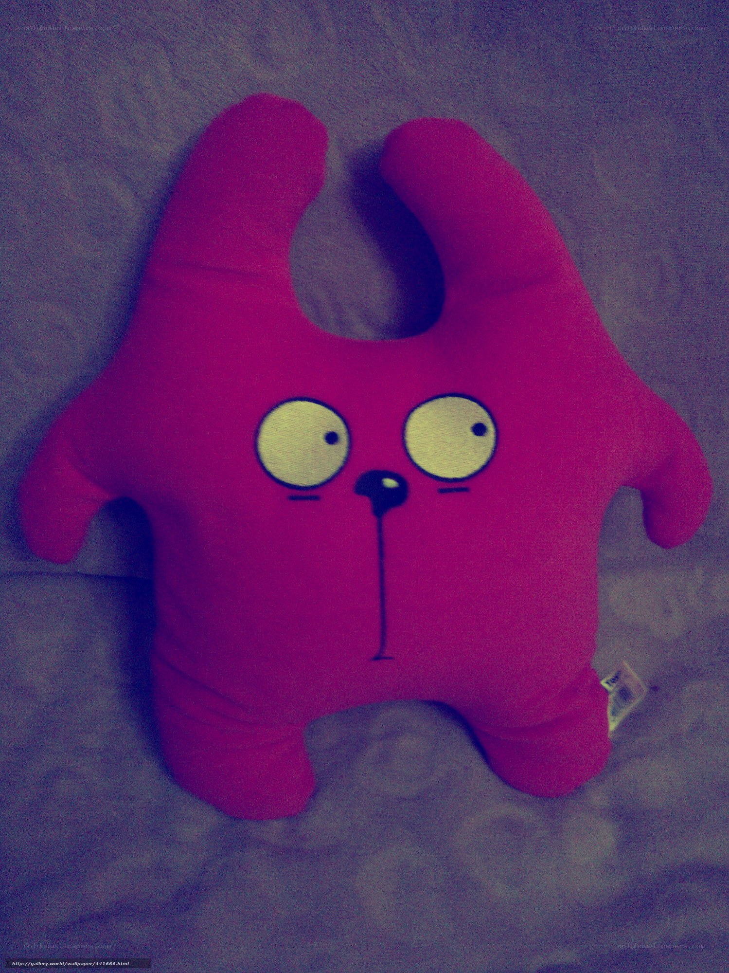 pink plush toy on bed