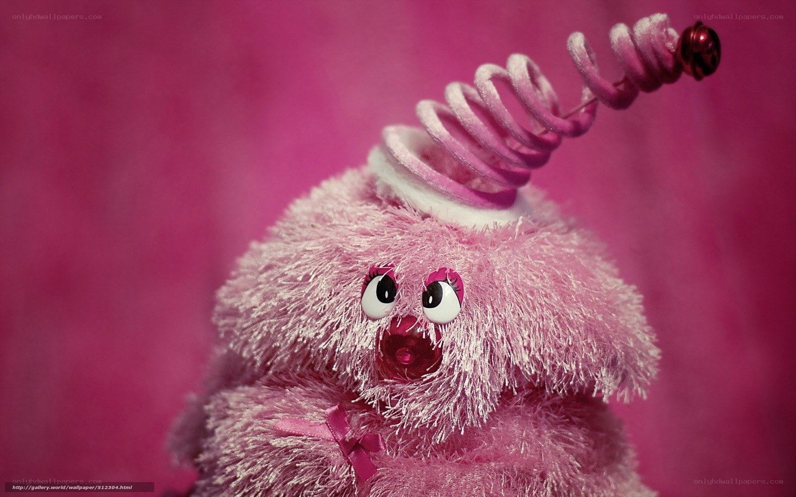 pink plush toy with spiral hat