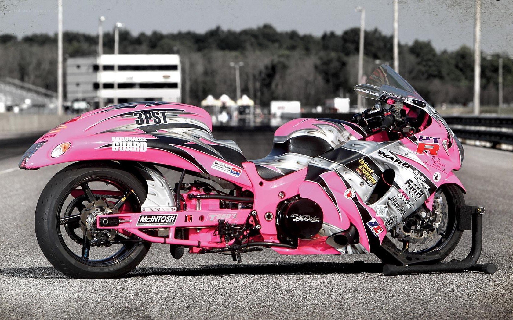 pink racing motorcycle on track