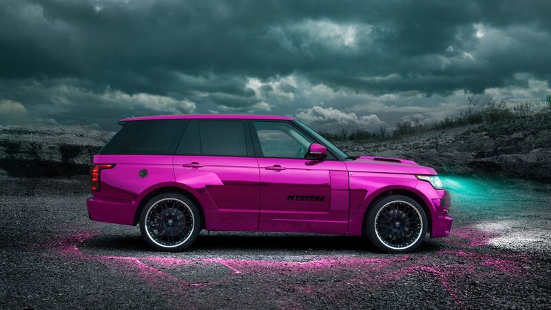 pink range rover on gravel