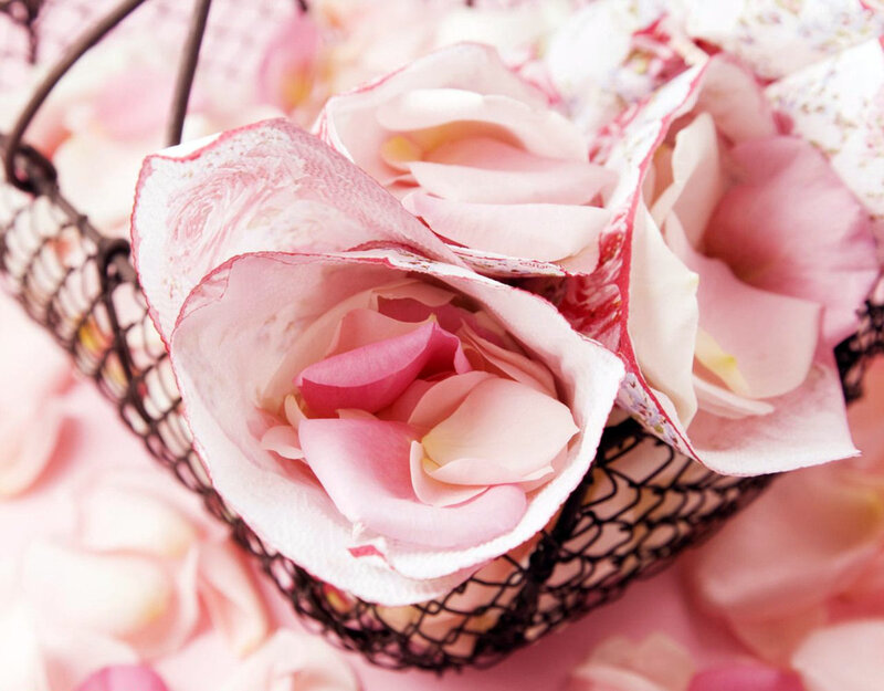 Pink rose petals in a basket