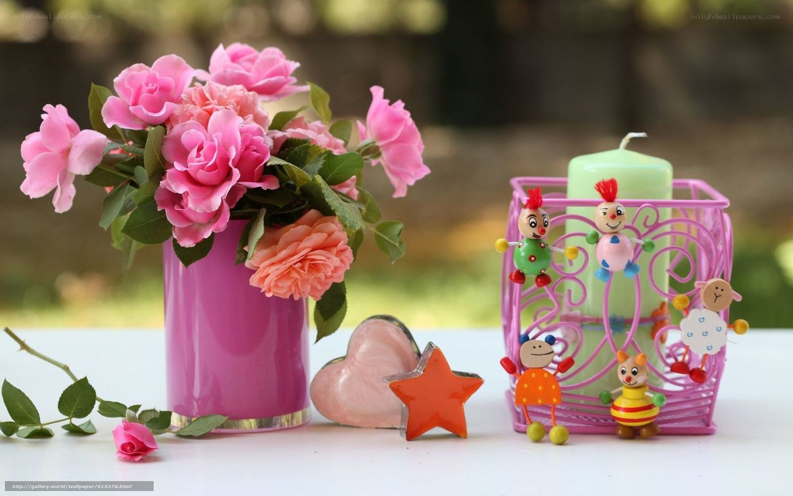 Pink roses and toys on table