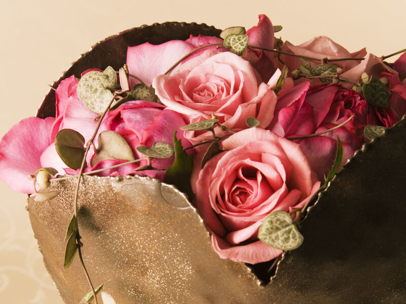 Pink roses in a golden vase