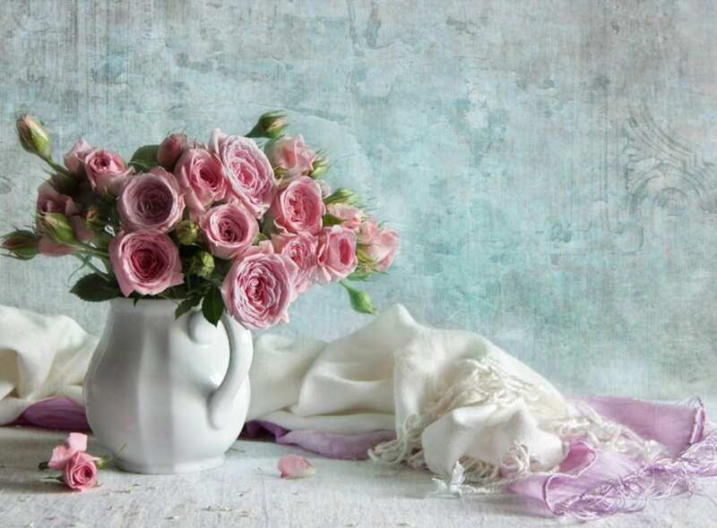 Pink roses in a white pitcher