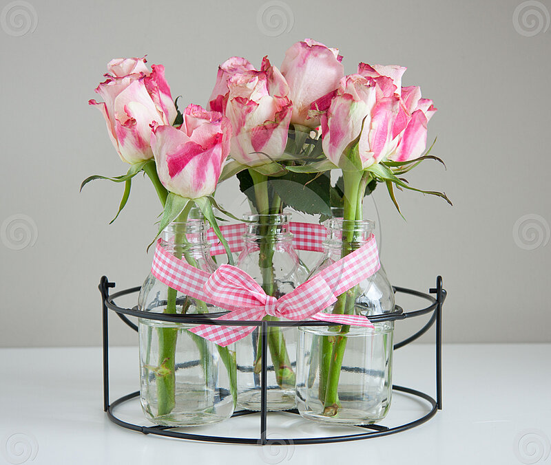 Pink Roses in Glass Bottles