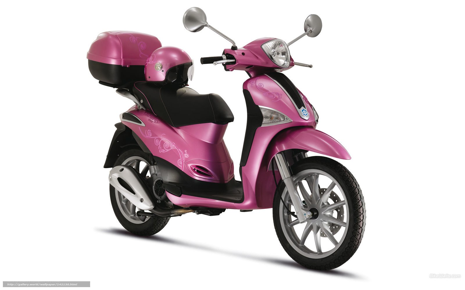 pink scooter with helmet