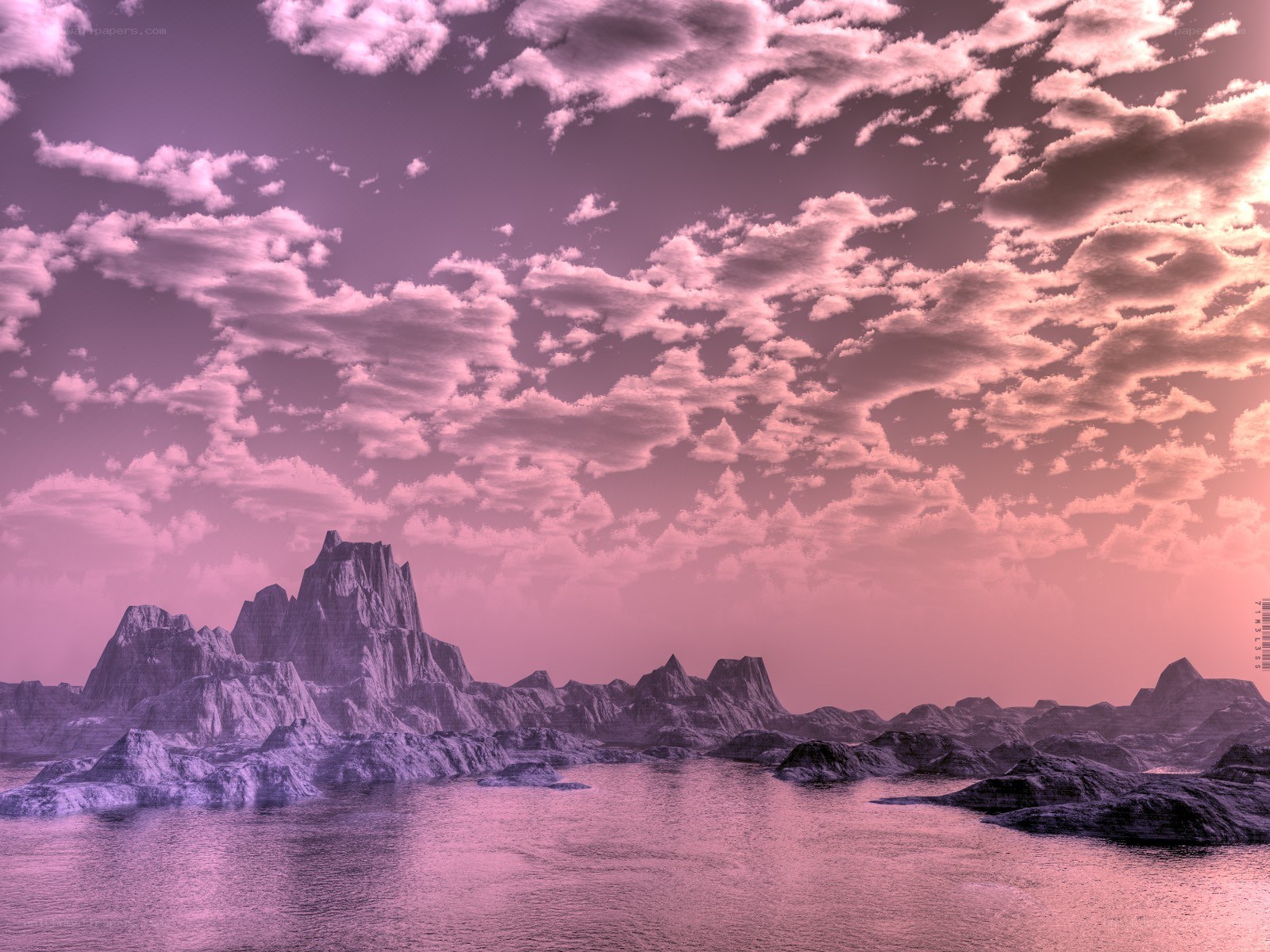 Pink sky over rocky landscape