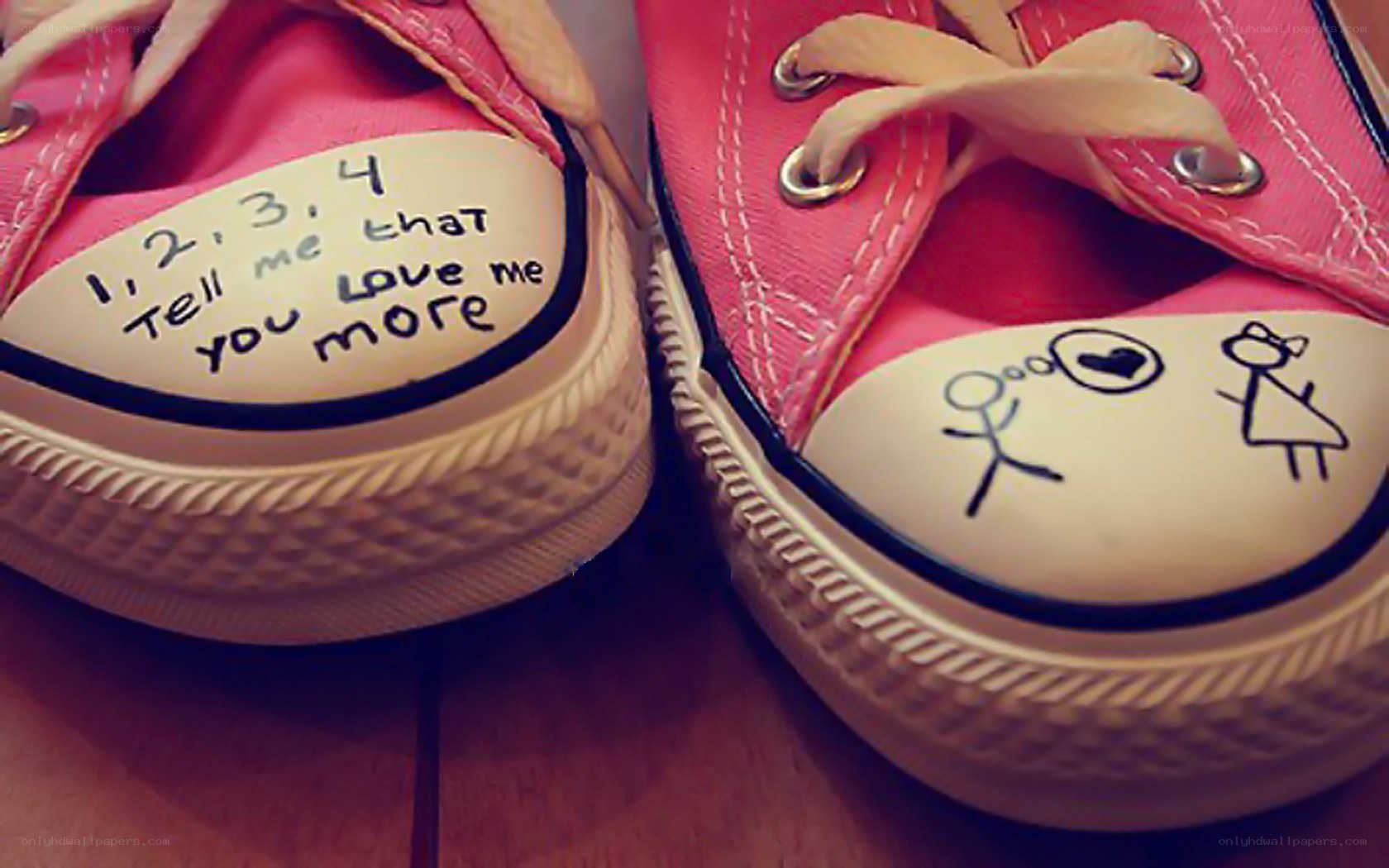 pink sneakers with handwritten messages