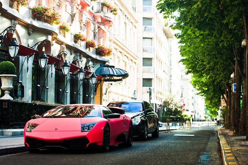 Pink sports car on a city street
