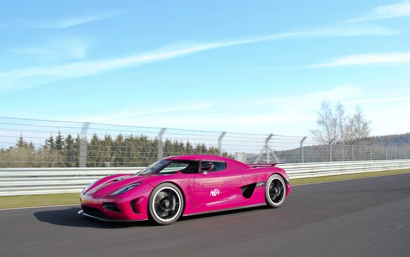 pink sports car on racetrack
