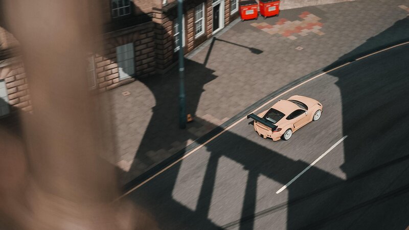 Pink Sports Car on Street — Dramatic