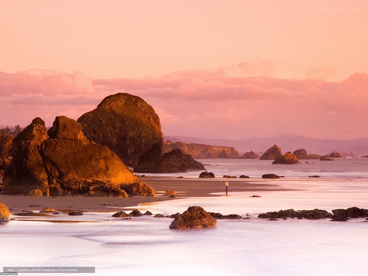 Pink sunset at the rocky beach