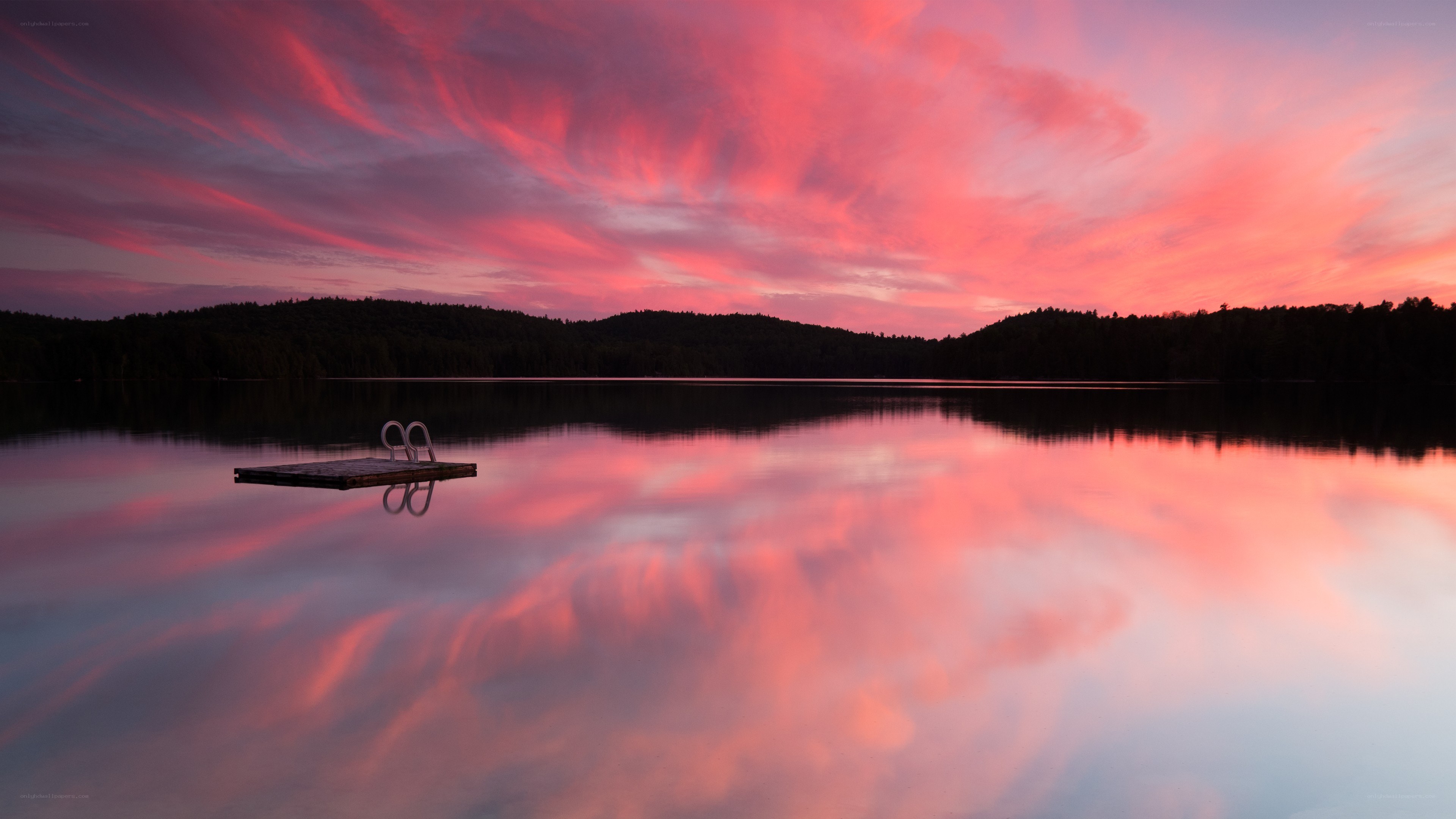 Pink sunset over a calm lake