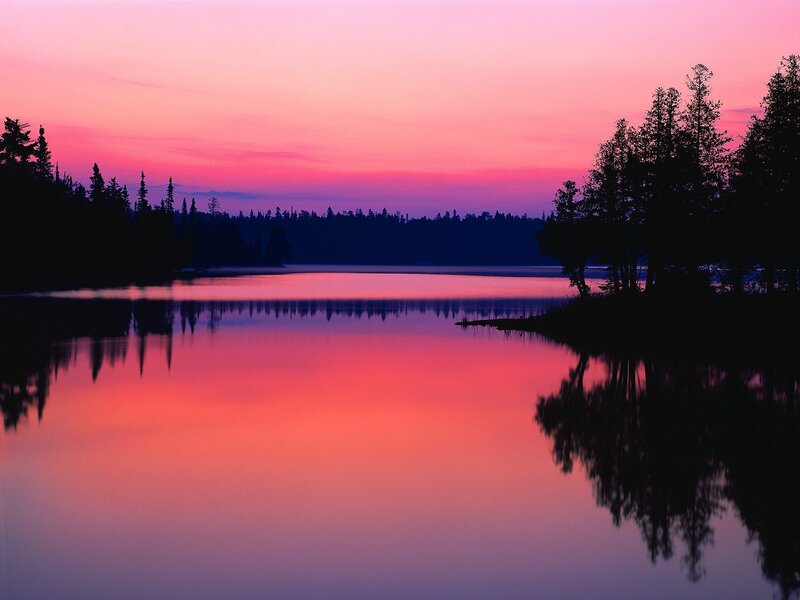 Pink sunset over a calm lake