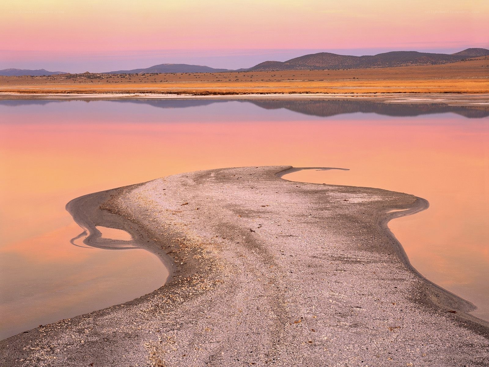 Pink sunset over a desert lake