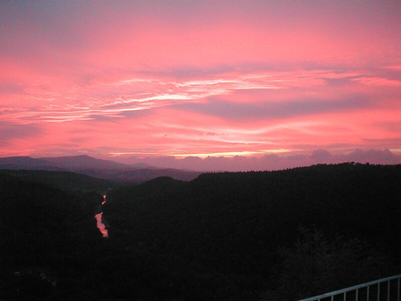 Pink sunset over a river valley