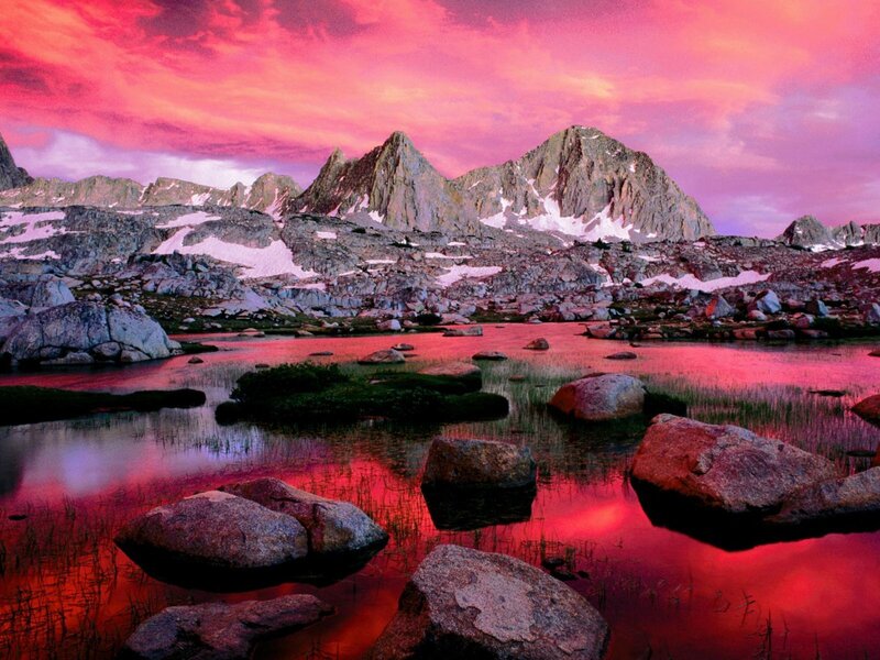 Pink sunset over mountain lake