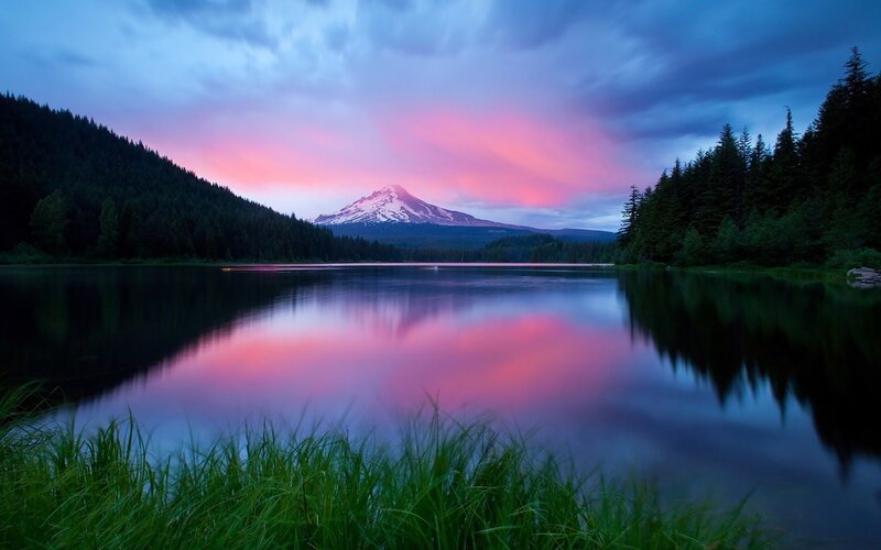 Pink sunset over mountain lake