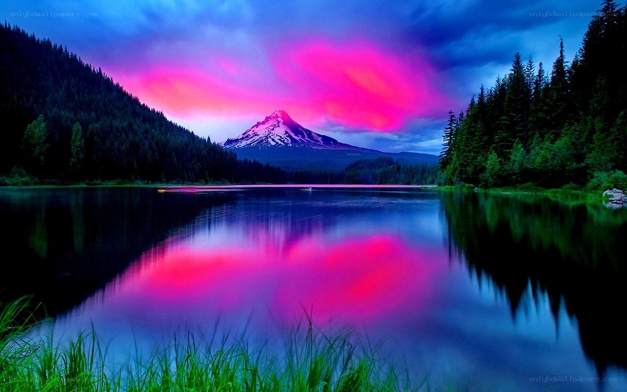 Pink sunset over mountain lake