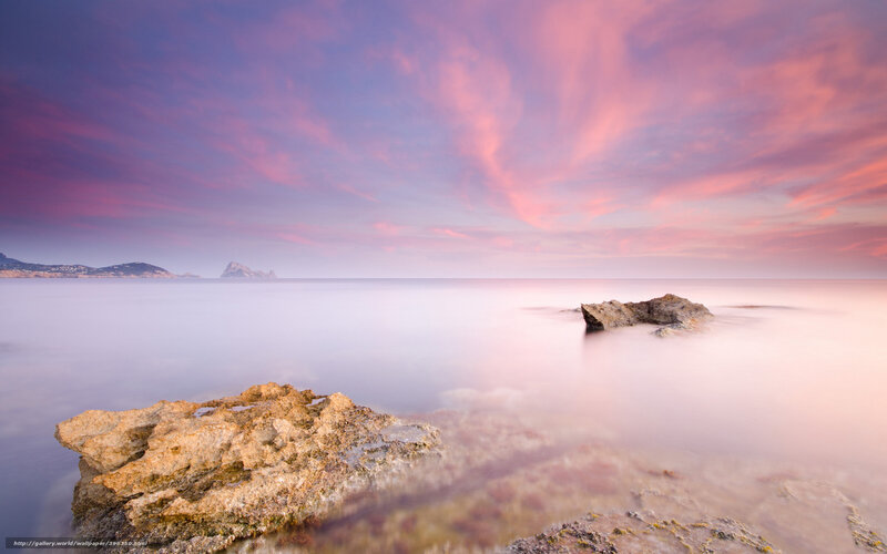 Pink sunset over rocky coast