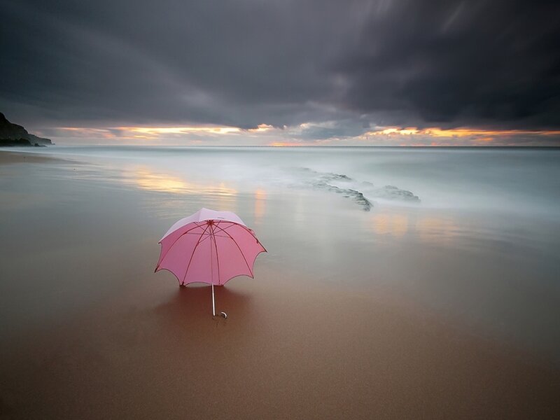 Pink Umbrella on Beach