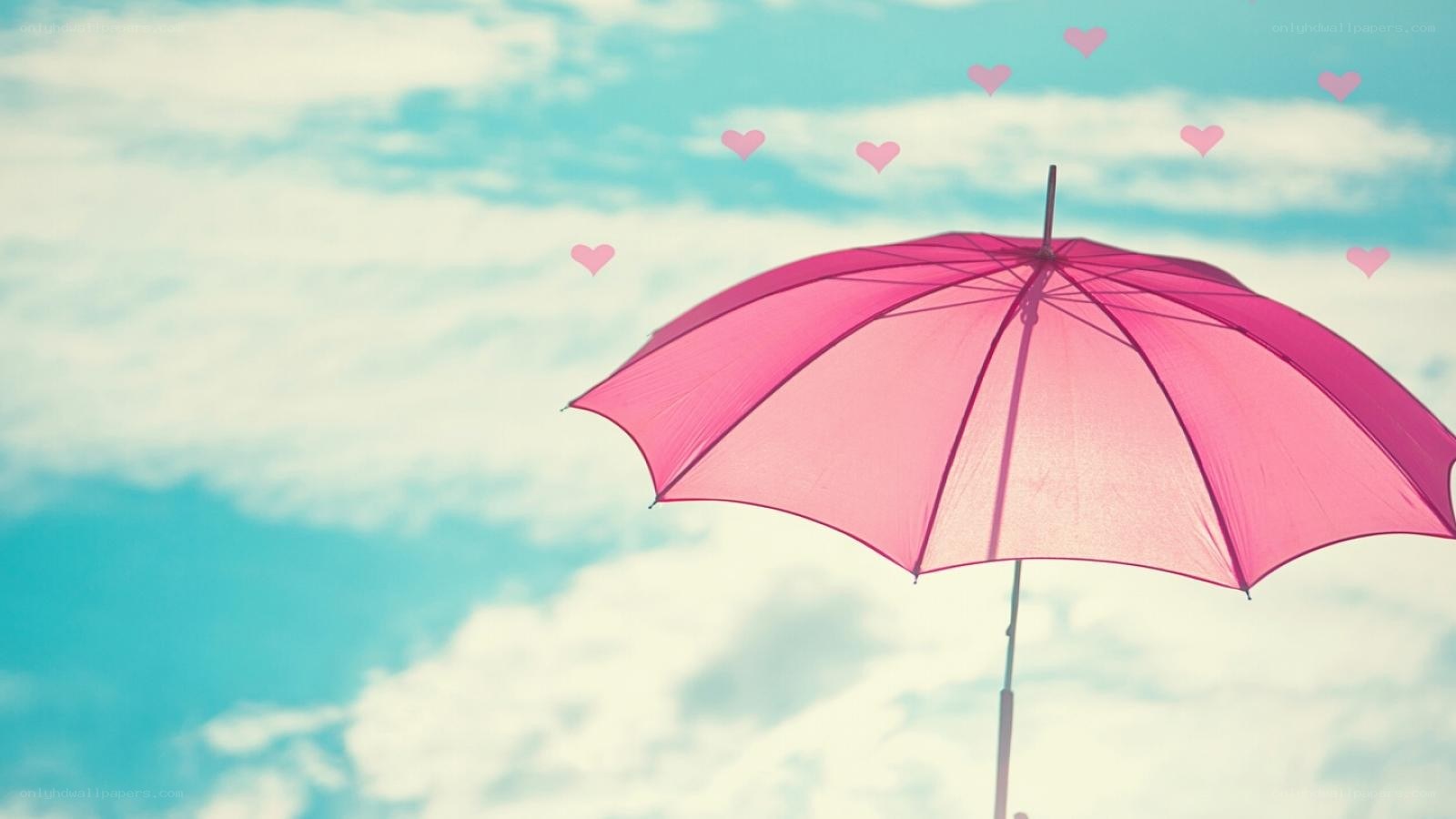 pink umbrella with hearts