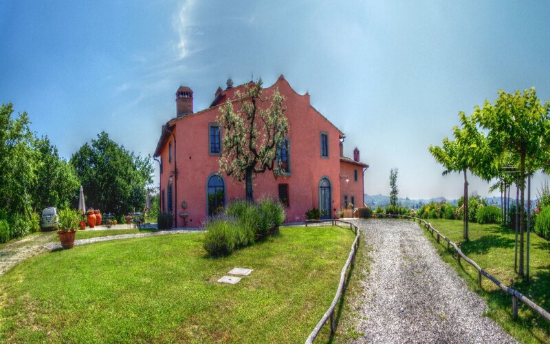 Pink villa in a green landscape