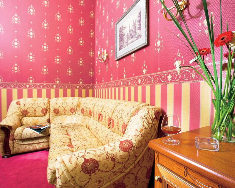 Pink-walled living room corner
