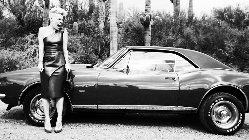 Pink with classic car in desert
