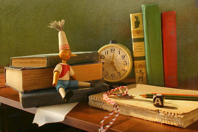 Pinocchio Doll on Books