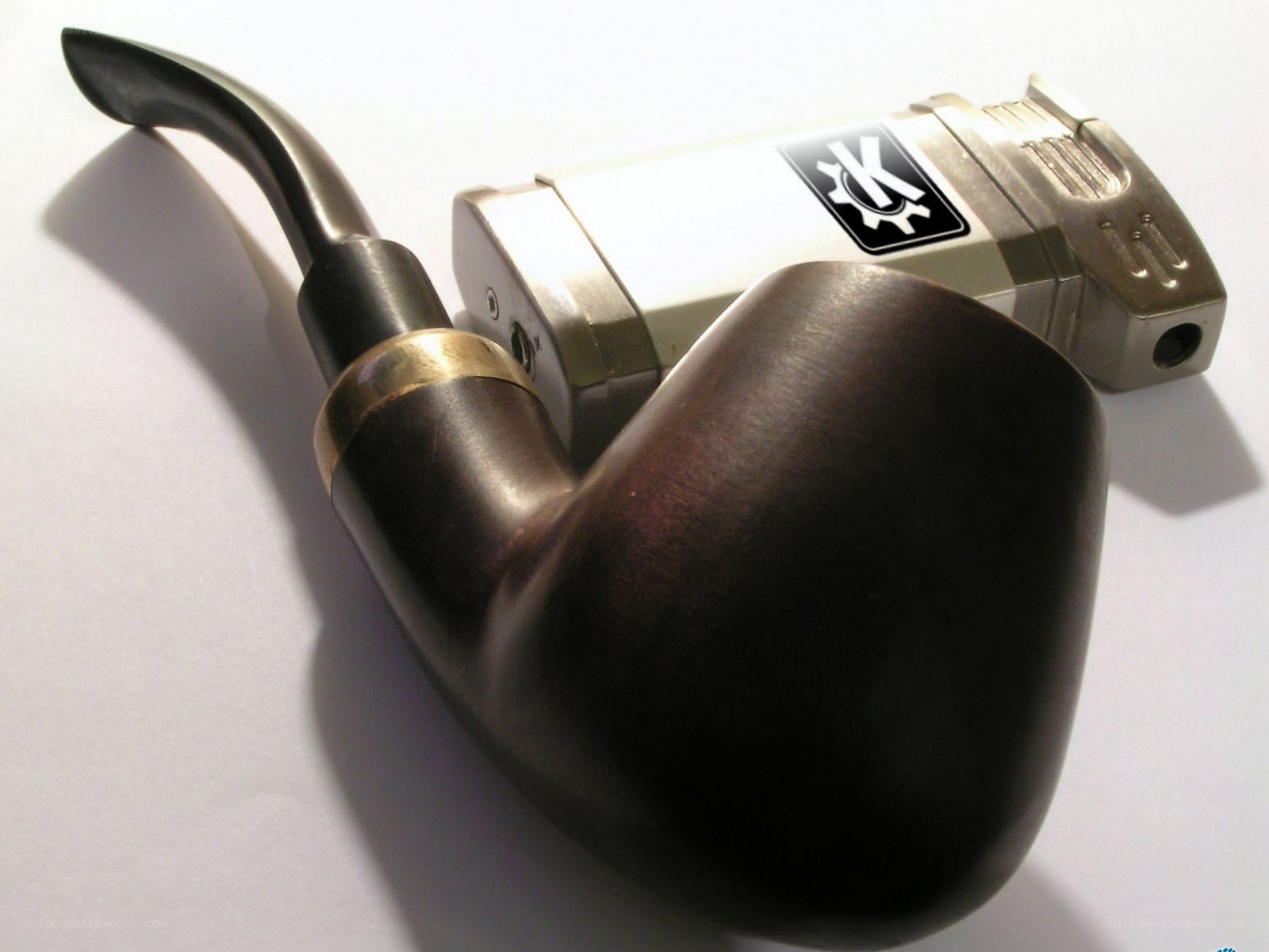 Pipe and lighter on white