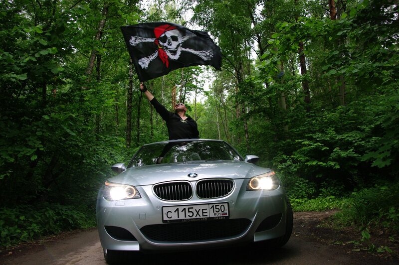 Pirate flag on car in forest