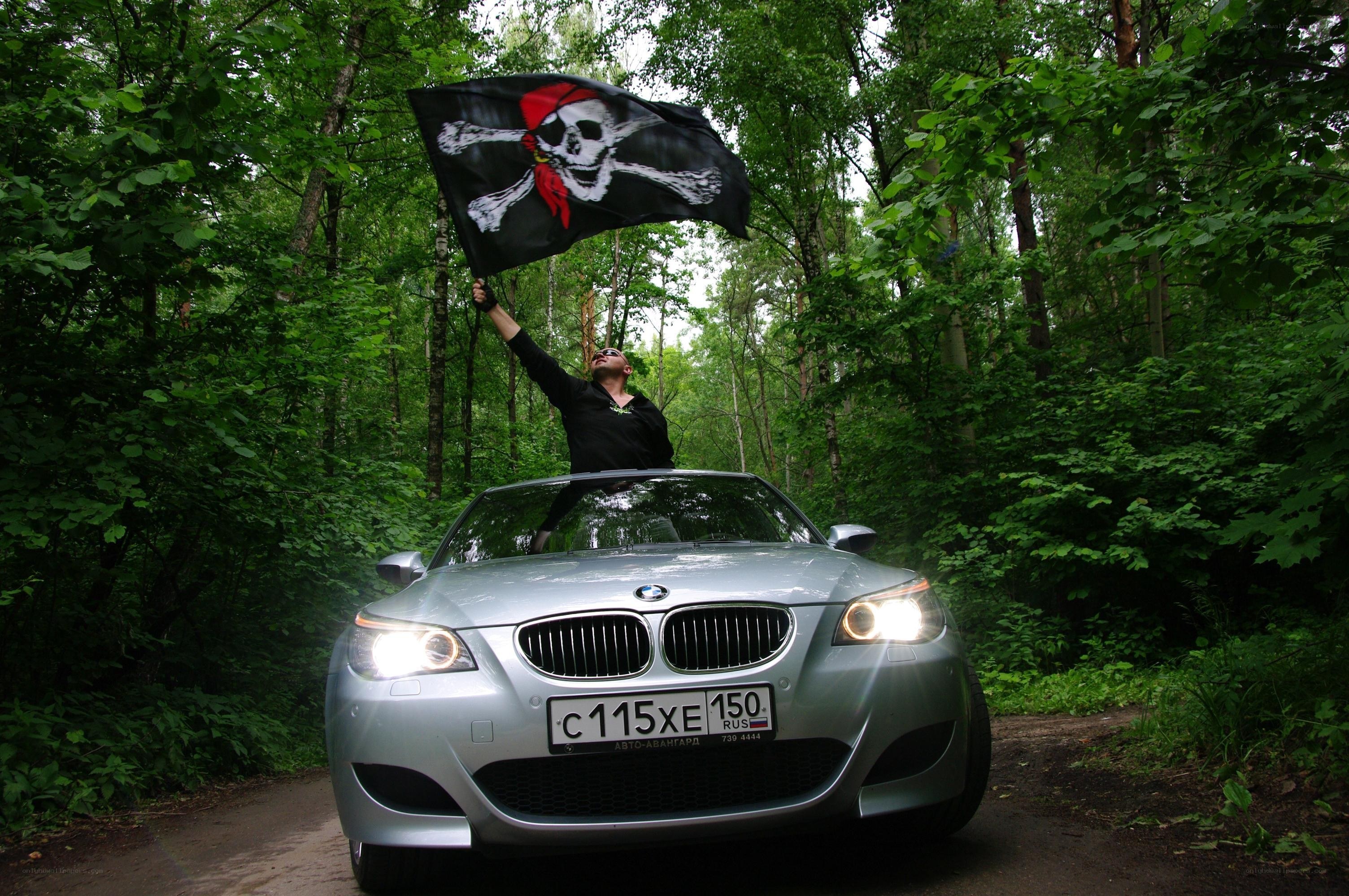Pirate flag on car in forest
