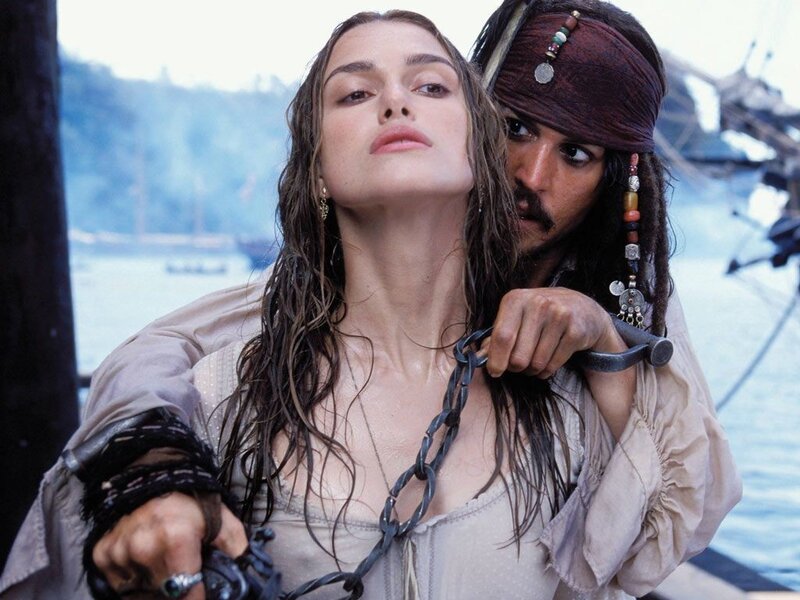 Pirate holding woman at sword point