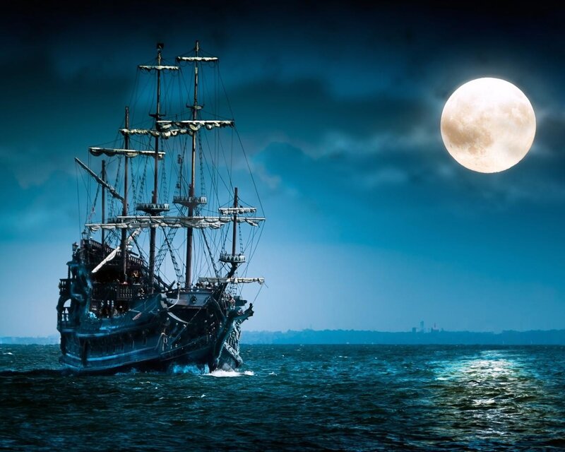 Pirate ship at night under full moon