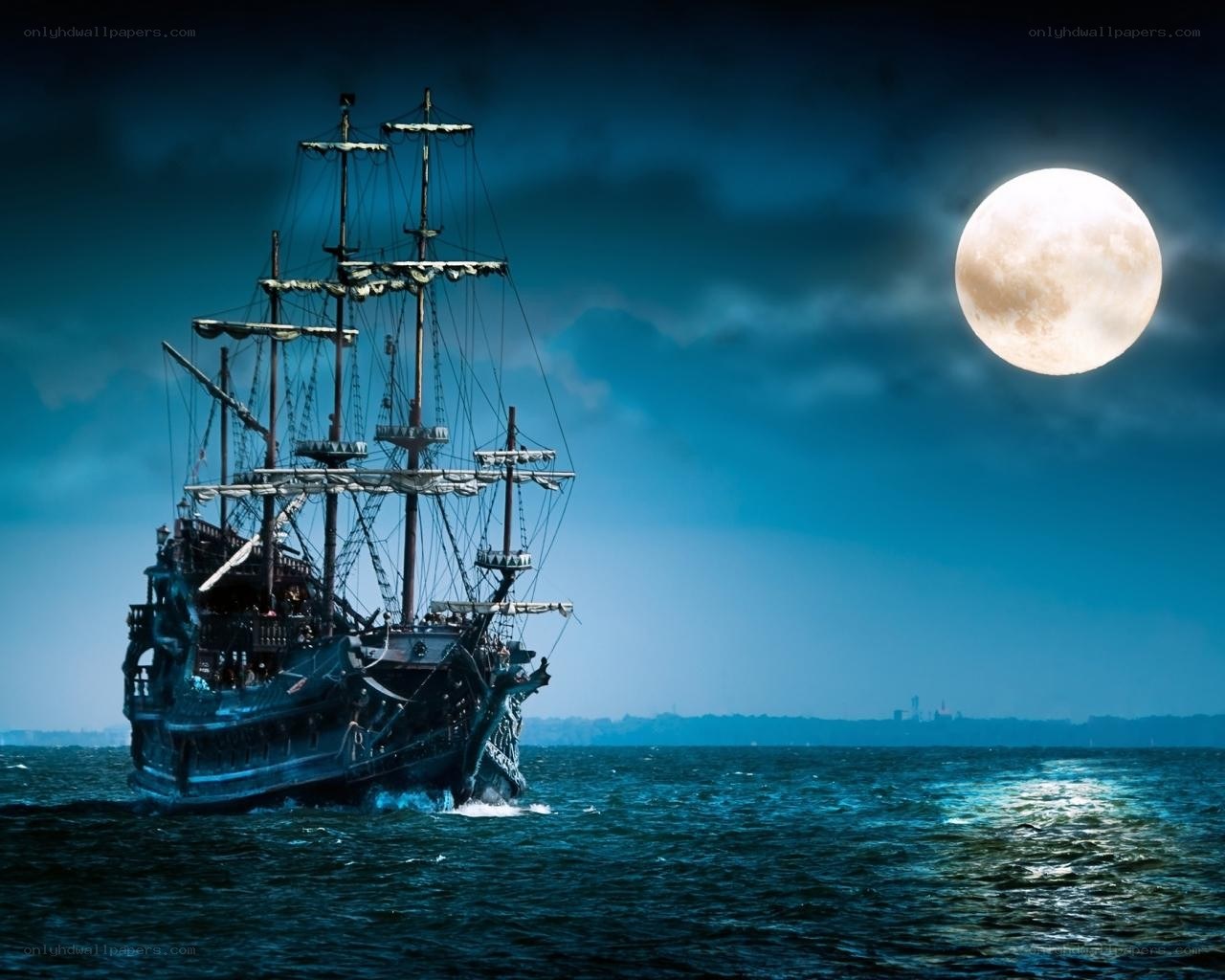 Pirate ship at night under full moon