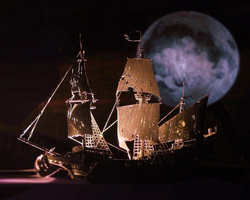 Pirate ship model under moonlight