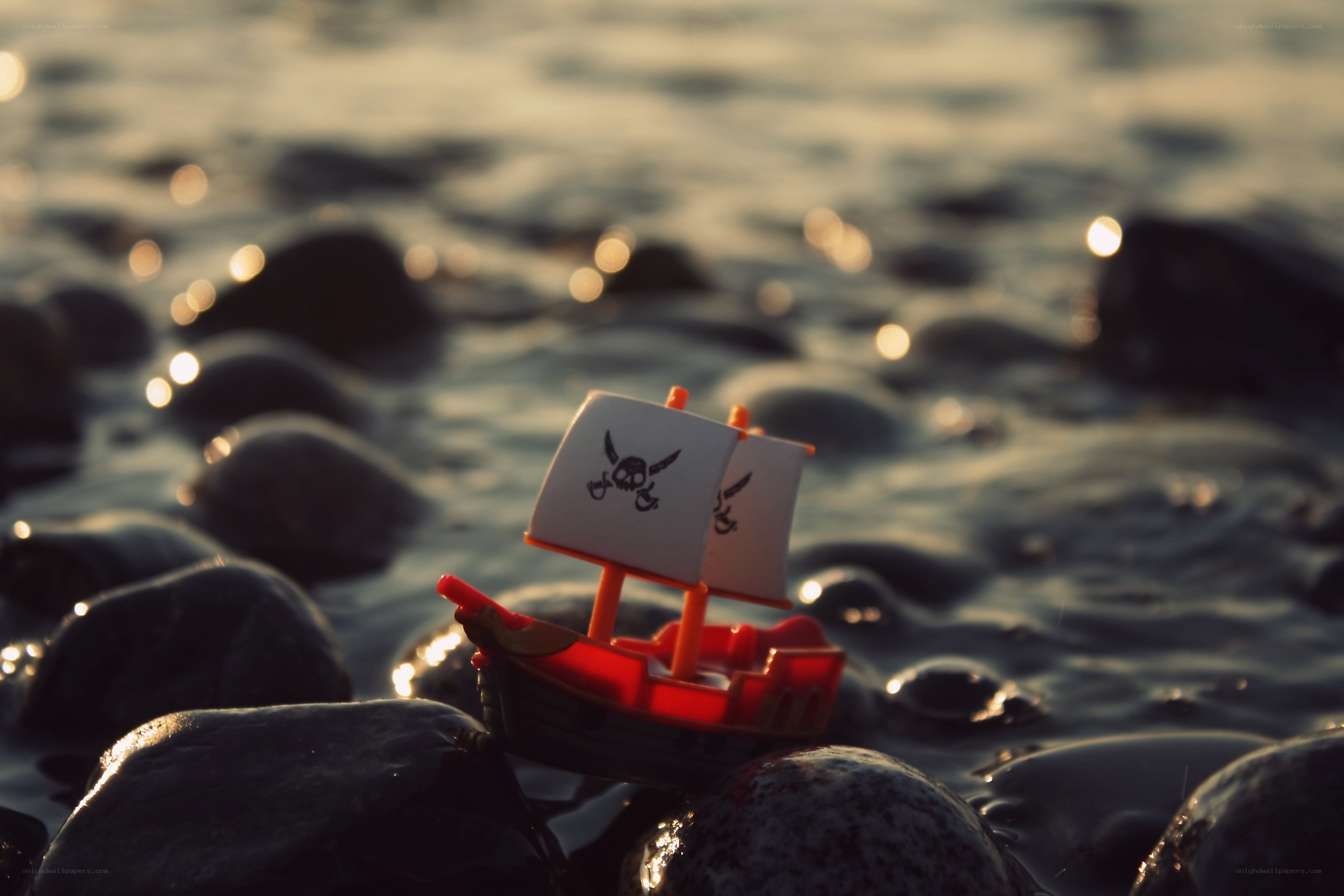 Pirate ship on wet rocks
