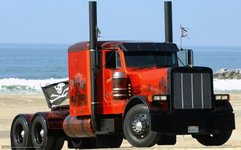 Pirate-themed red semi-truck on beach